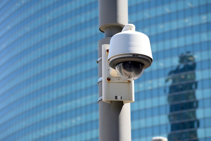 A surveillance camera mounted on a pole.